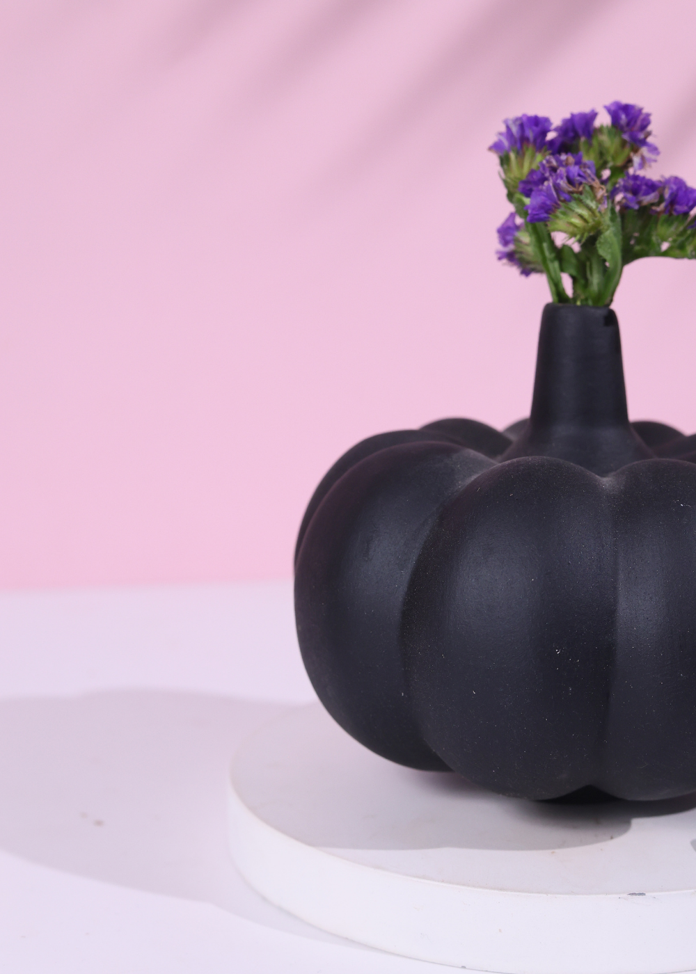 black pumpkin vase with flower