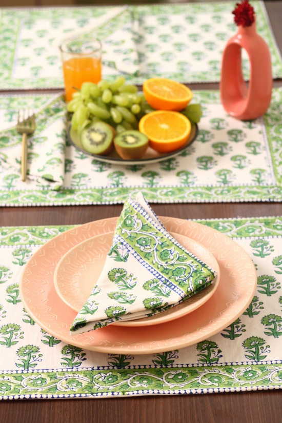 Green floral table mat & napkin on table 