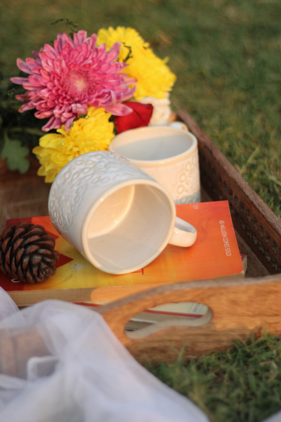 Ceramic coffee mugs in wooden tray 