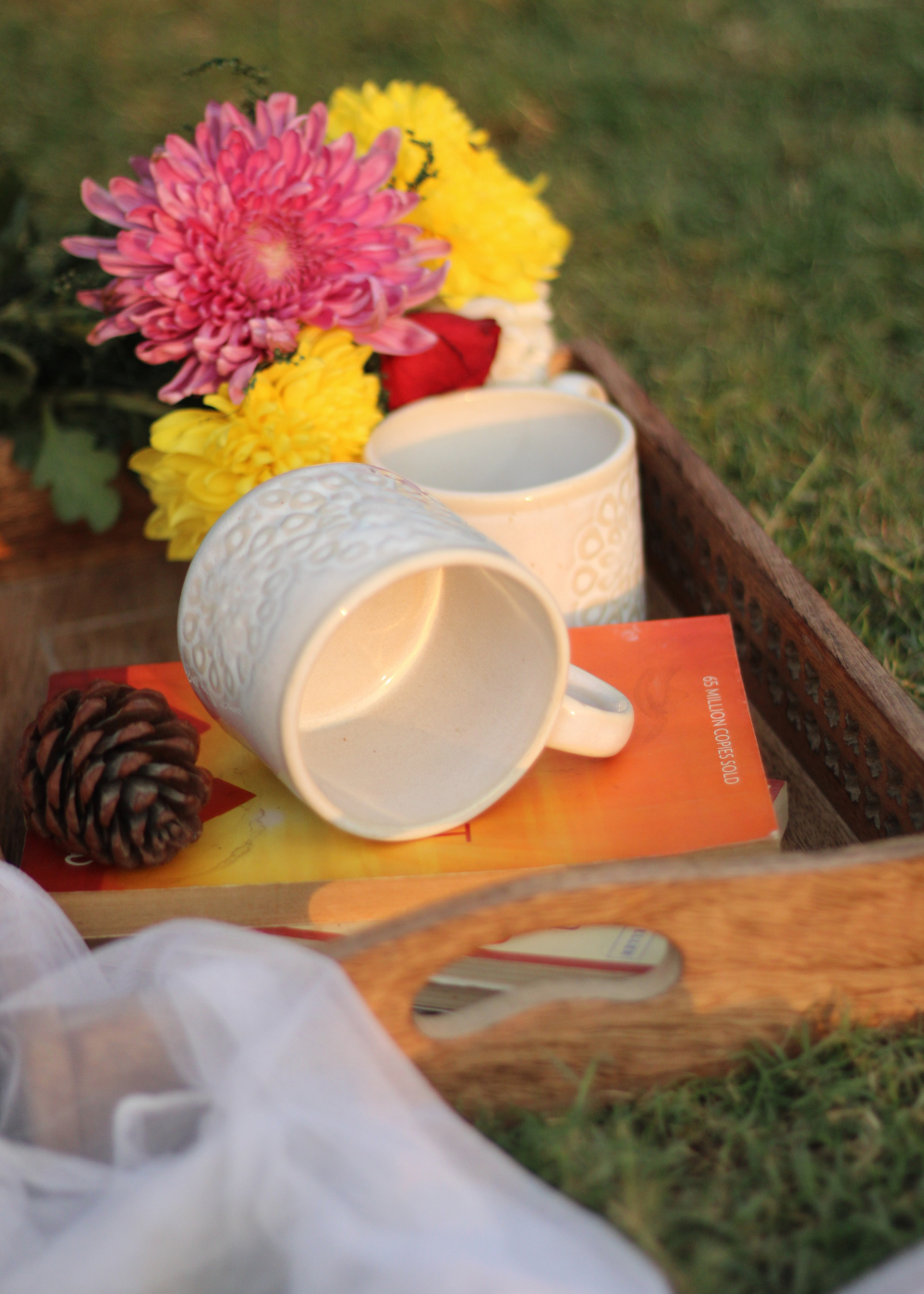 Ceramic coffee mugs in wooden tray 