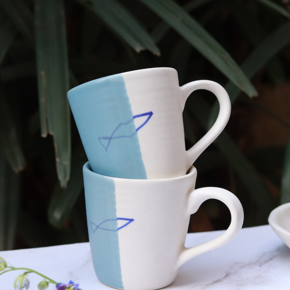 Handmade ceramic coffee mug on each other