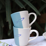 Handmade ceramic coffee mug on each other