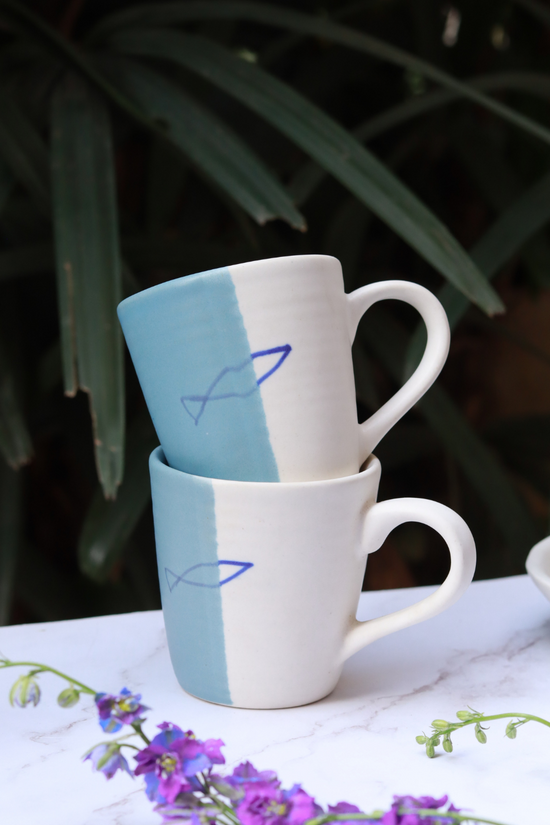 Handmade ceramic coffee mug on each other