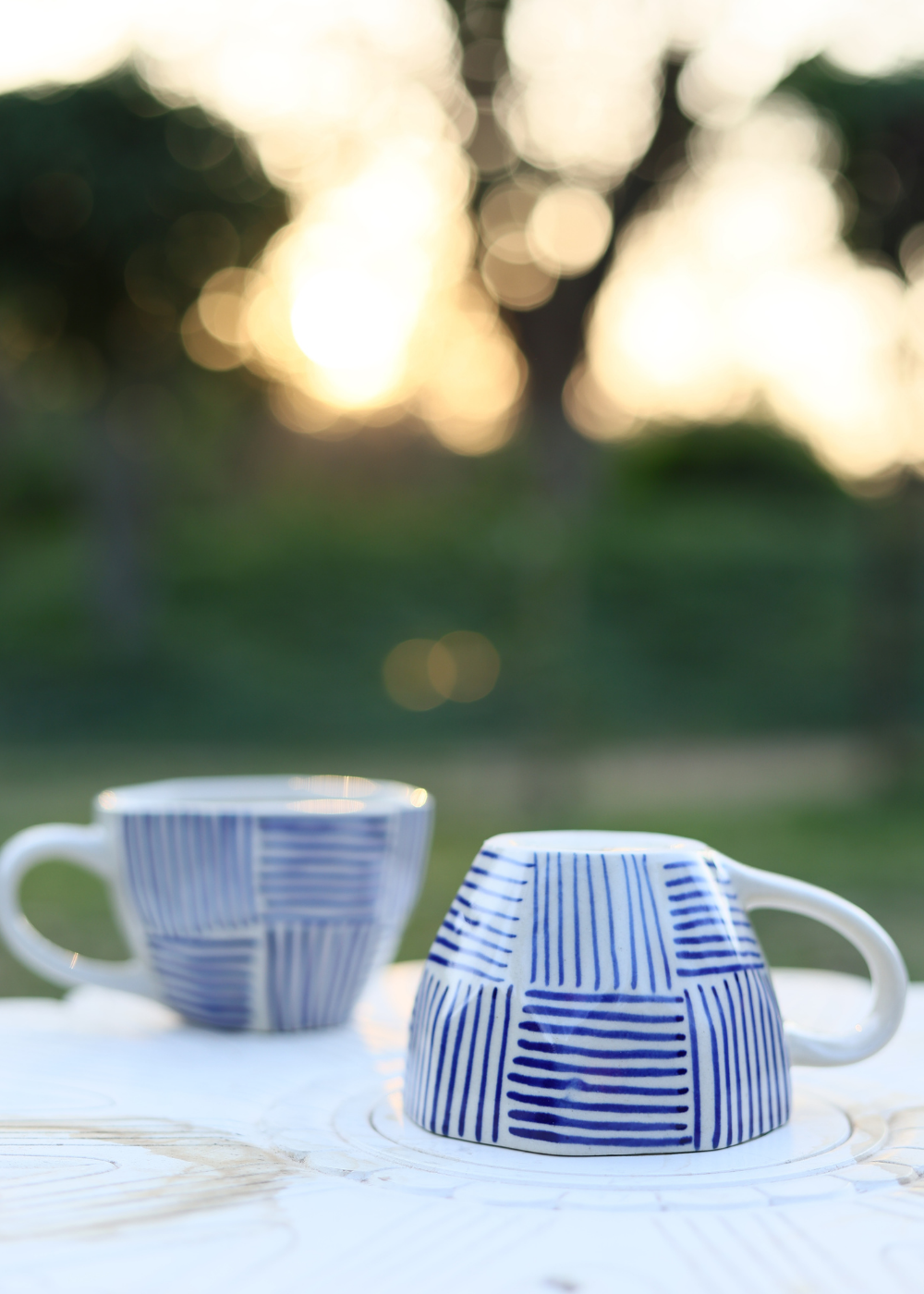 Two coffee mugs in different position