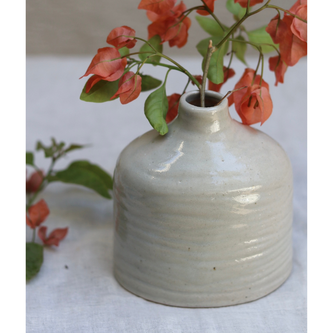 Grey handmade vase with flowers 