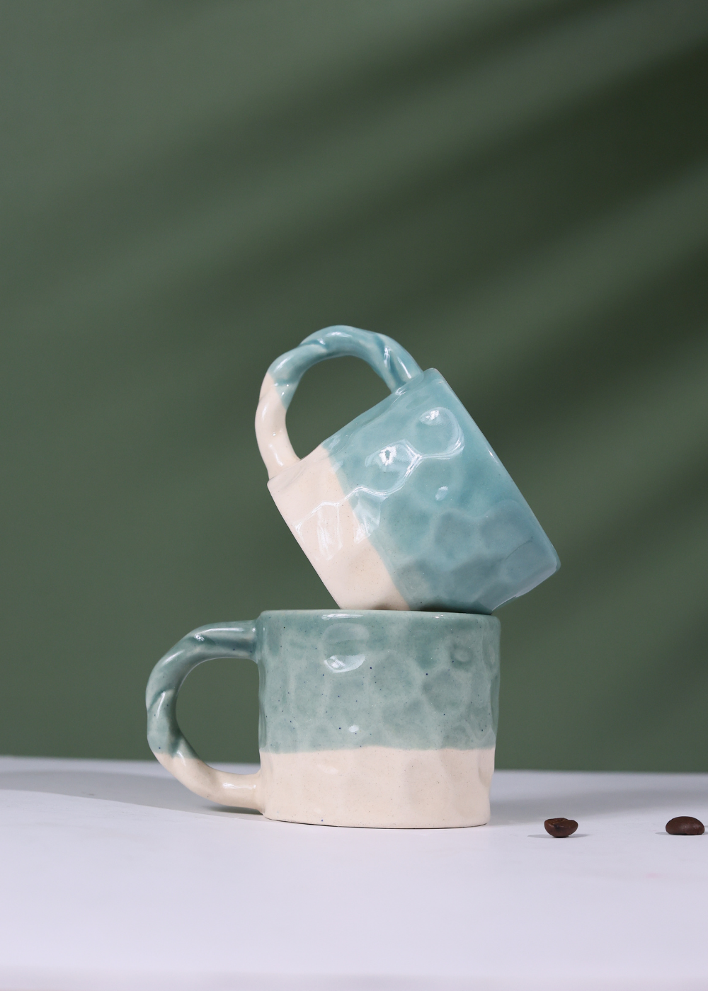 Two Ceramic Teal Handmoulded Mugs