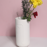 Unique design face vase with red and yelllow flowers