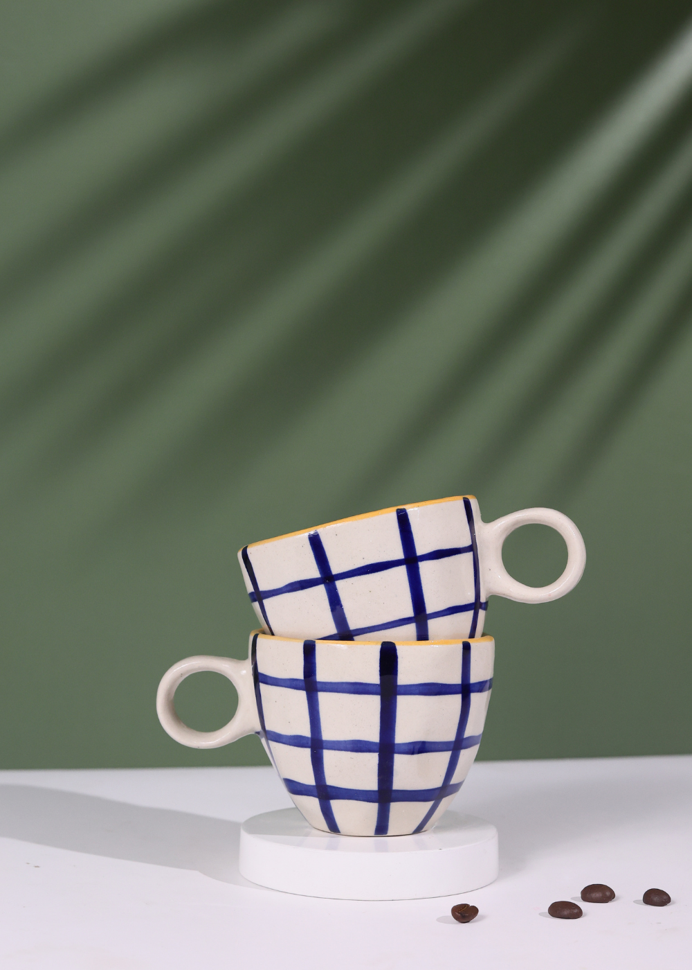 Blue checks coffee mug on each other
