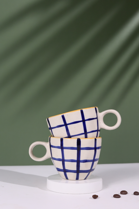Blue checks coffee mug on each other