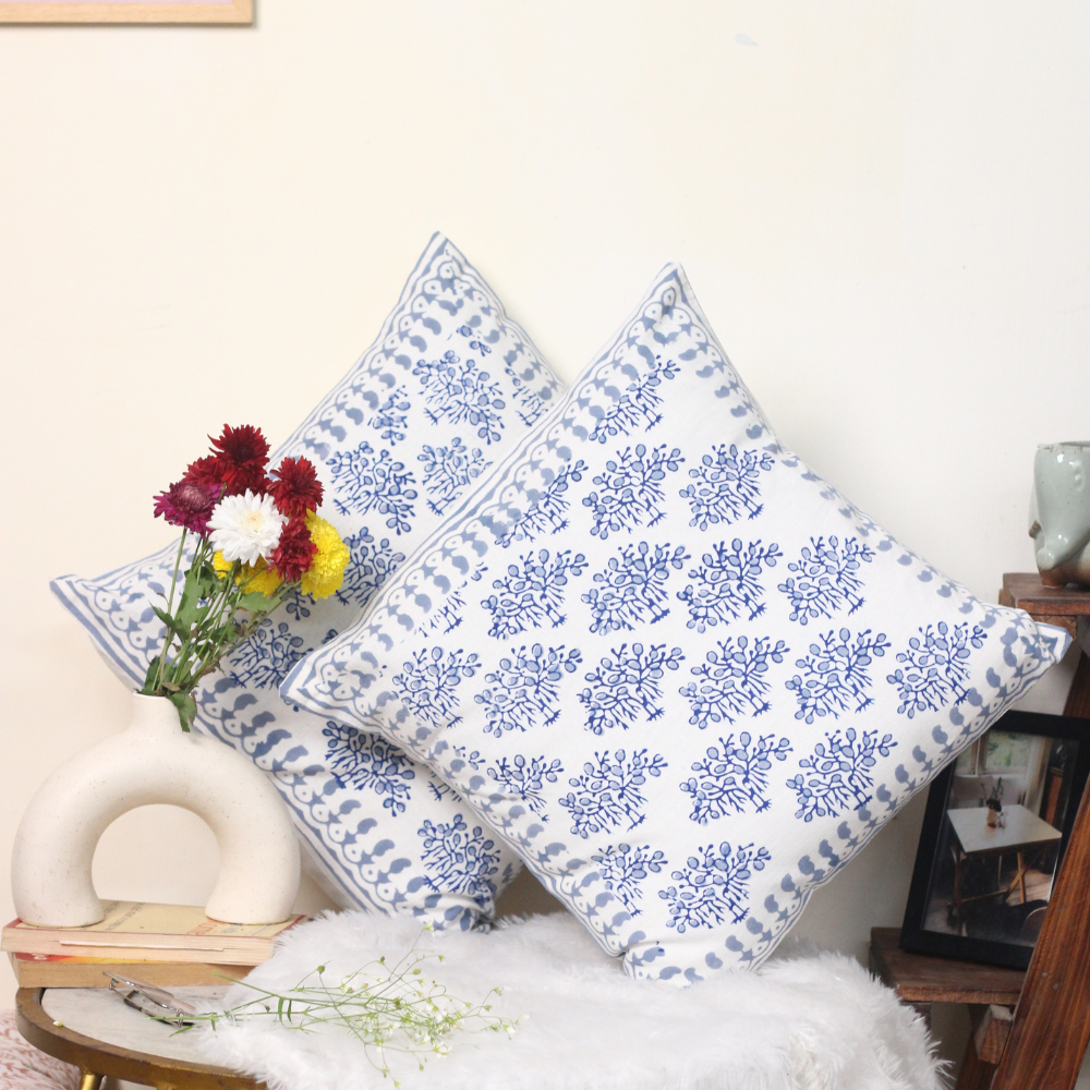 Blue banyan tree cushion cover on a chair