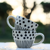 Two black lines meet polka white coffee mug