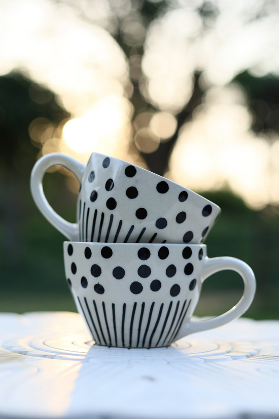 Two black lines meet polka white coffee mug