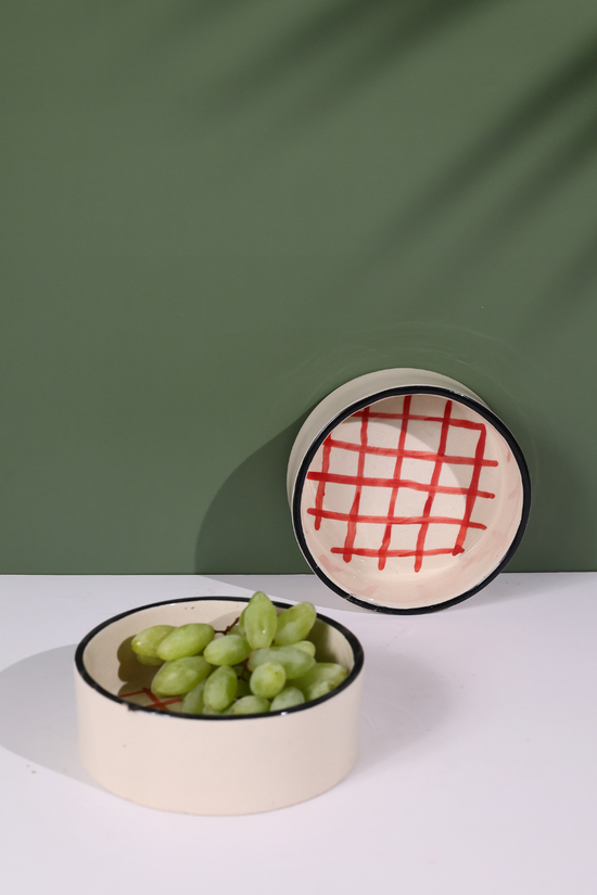 Red checks breakfast bowl with grapes