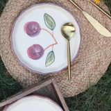 Cherry plate with mat and cutlery