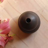 Top shot of black moulded vase