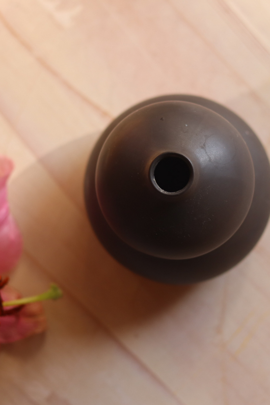 Top shot of black moulded vase