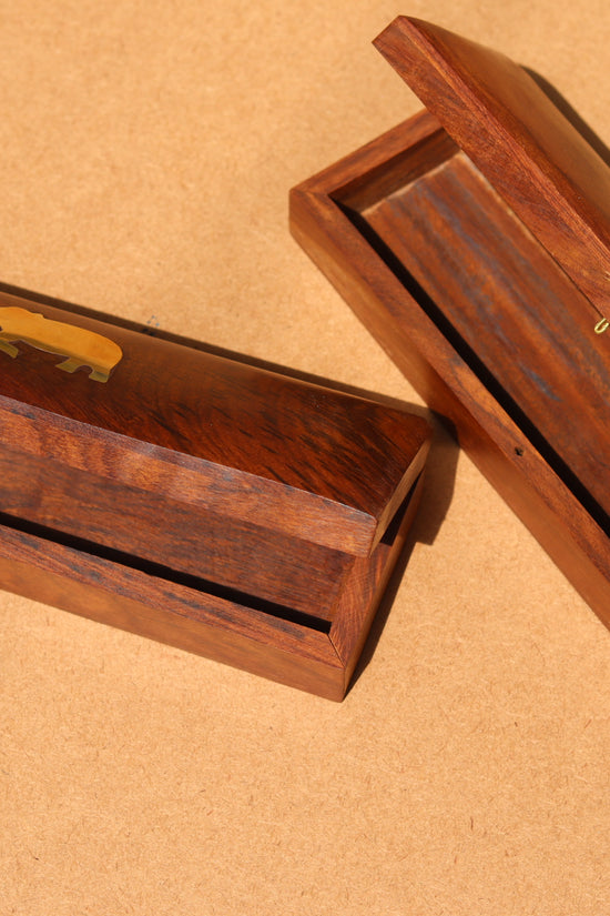 Golden elephant on wooden pencil boxes