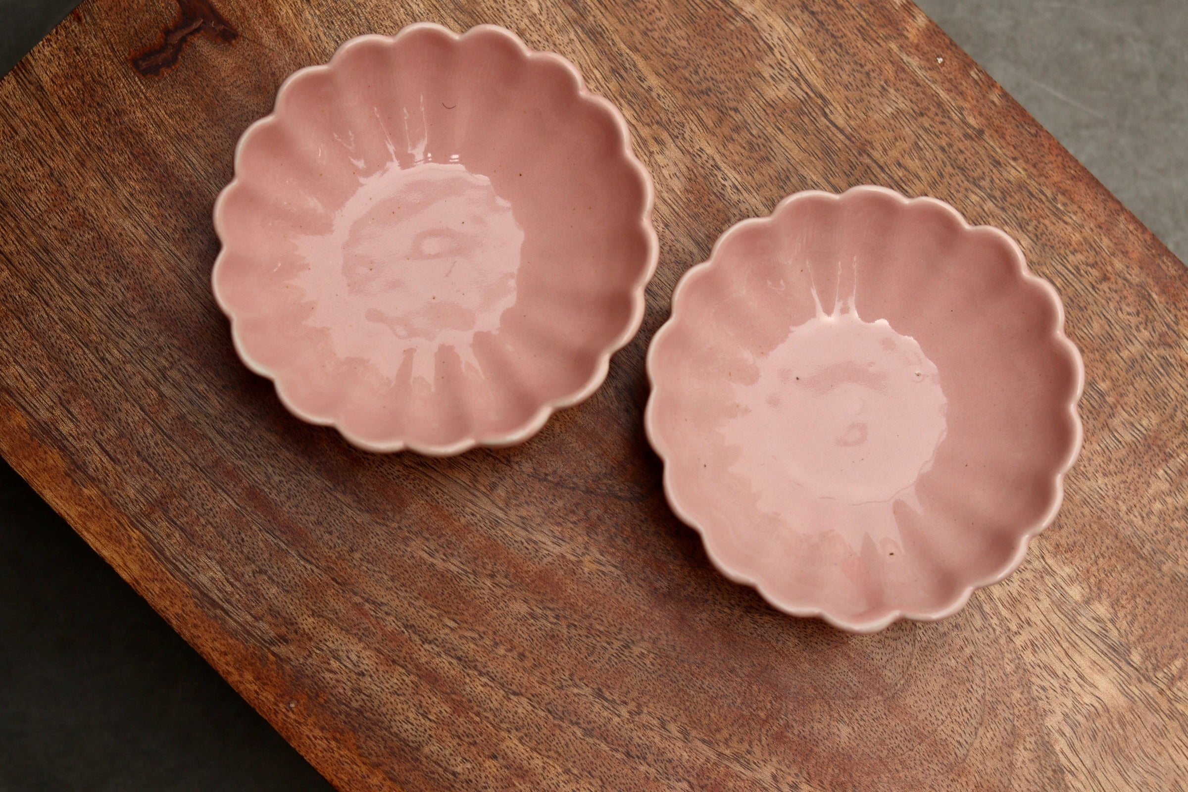 Handmade ice cream bowls on wooden surface