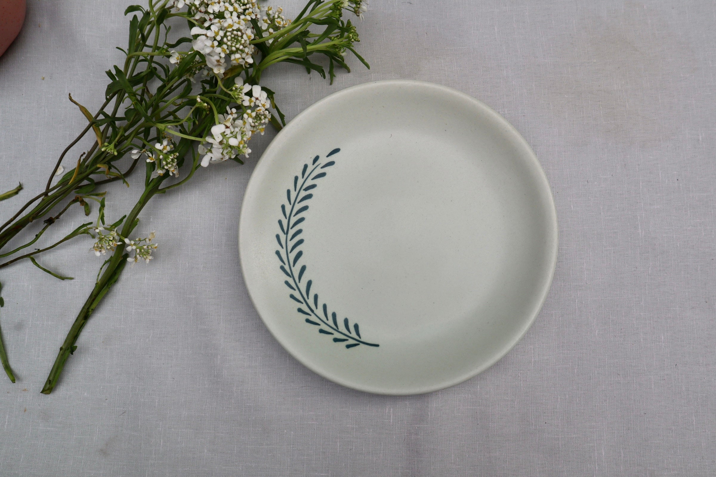 White ceramic dessert plate leaf design 