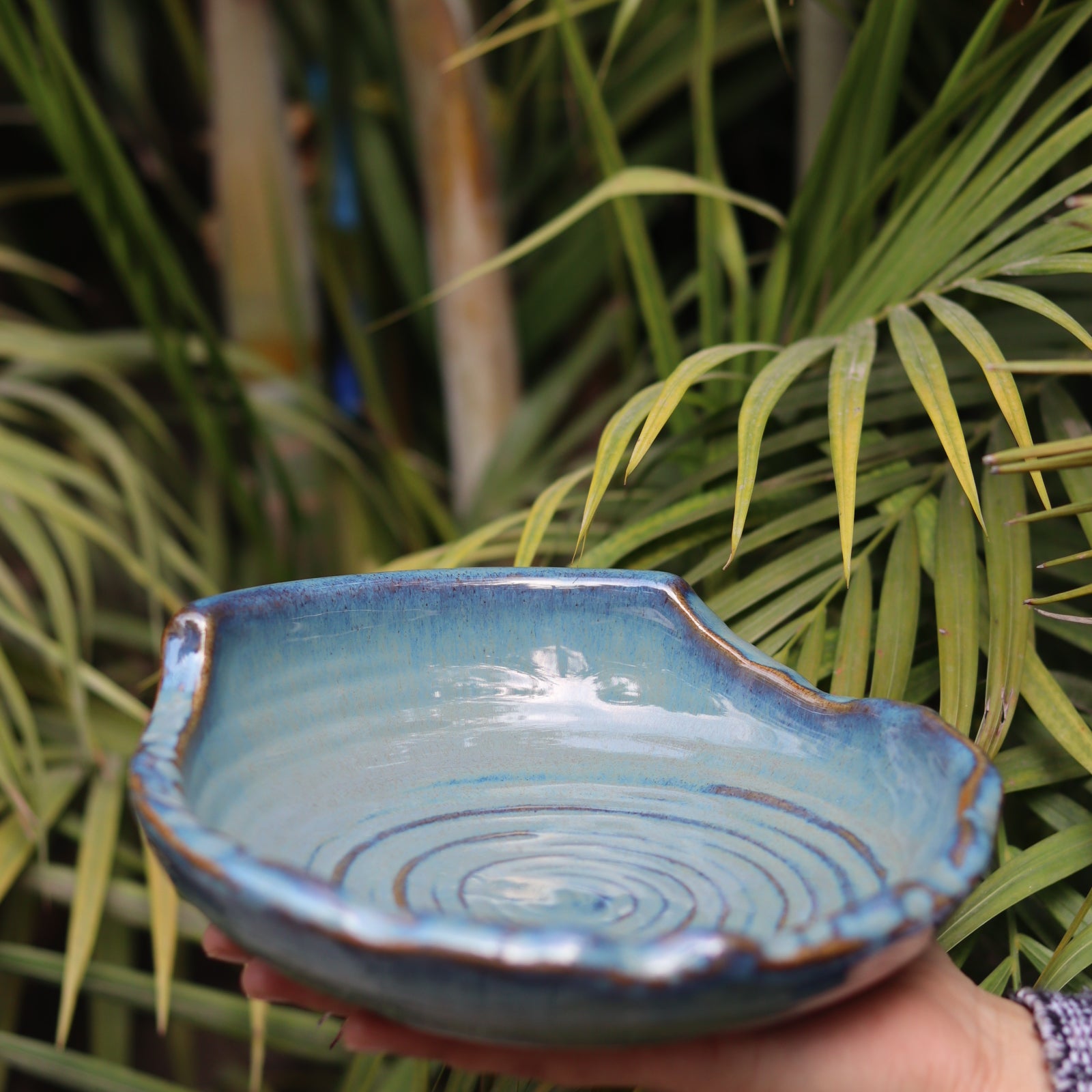 Ceramic grey bowl in hand 