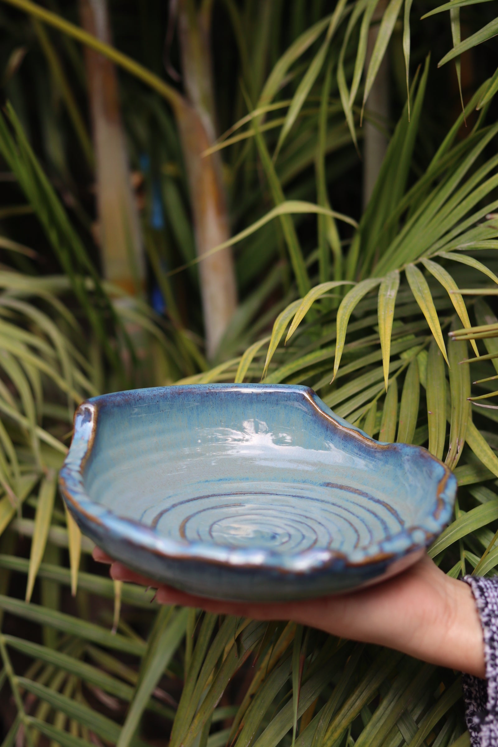 Ceramic grey bowl in hand 