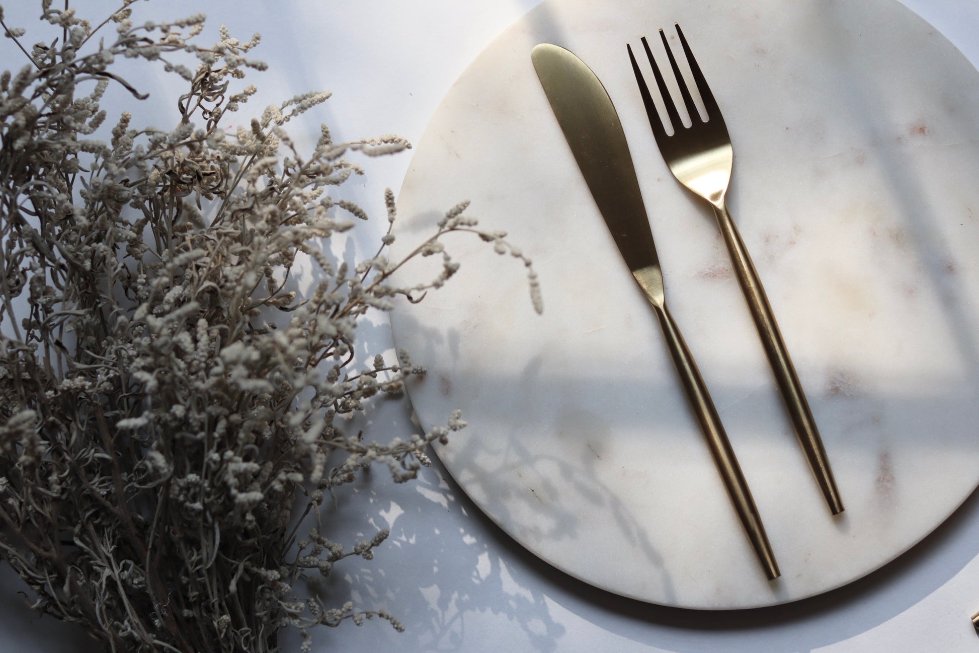 Gold knife on marble
