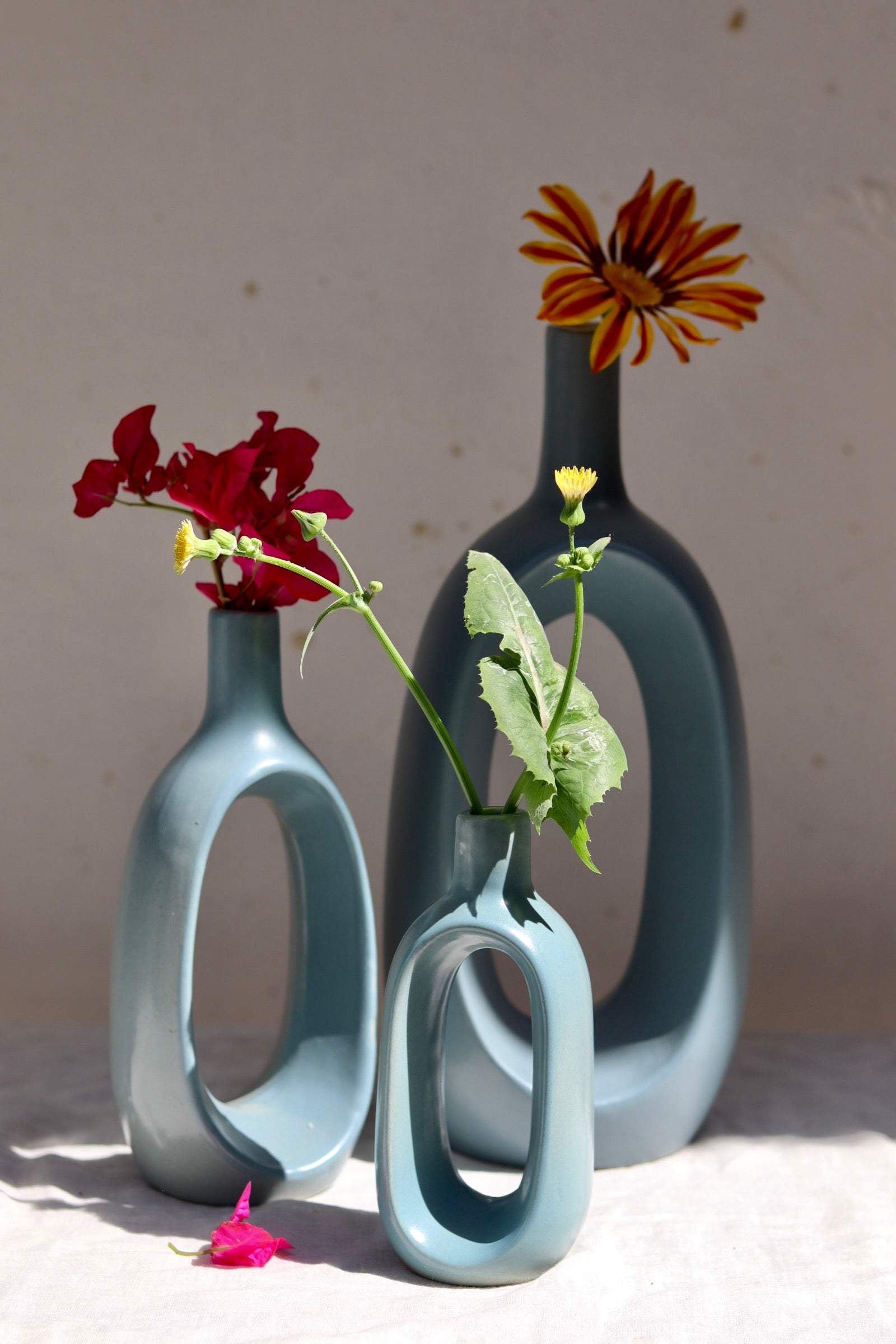 Three contour vases with flowers