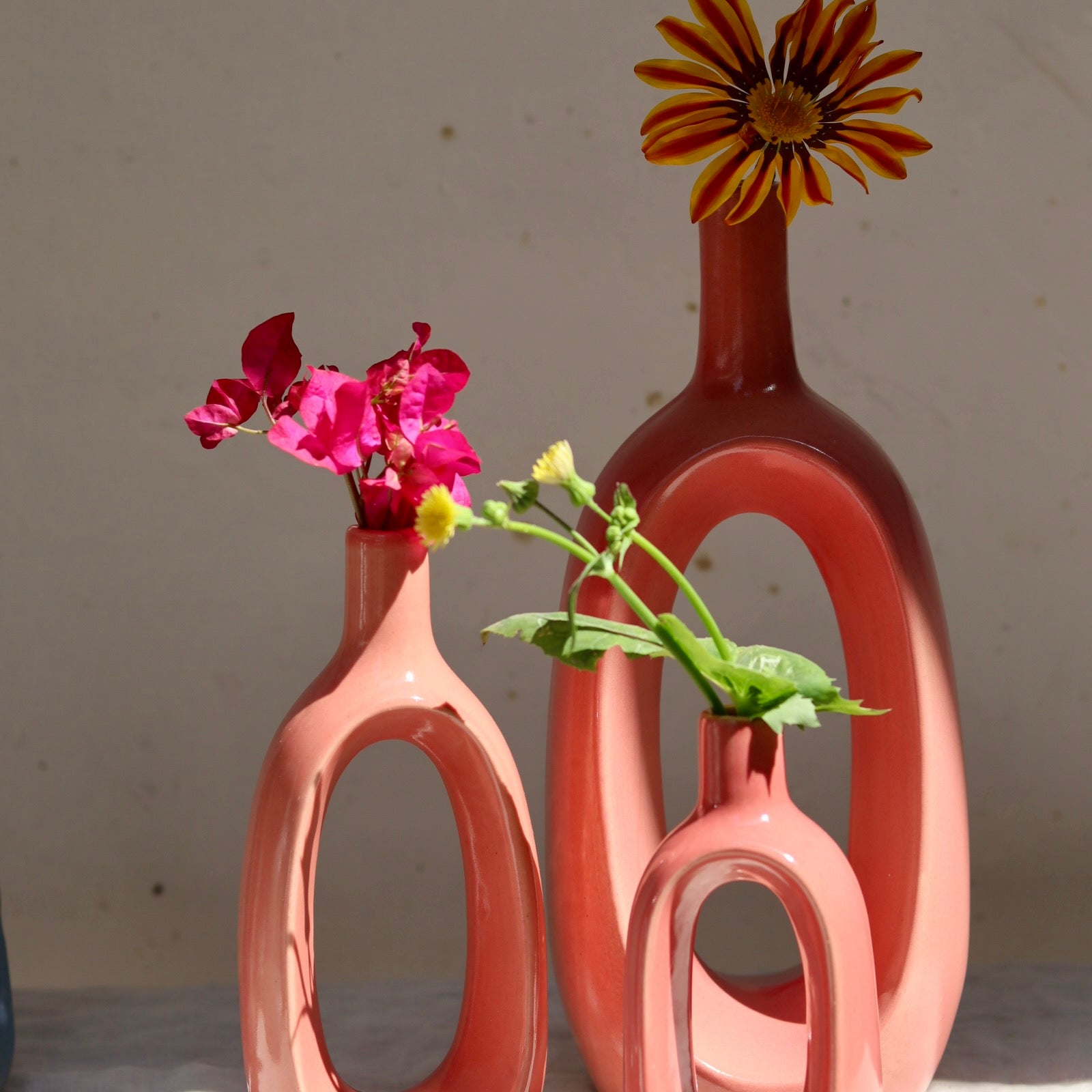 Ceramic pink vases with flowers 