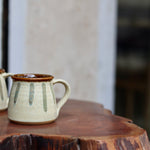 Cream chai cup on a wooden table