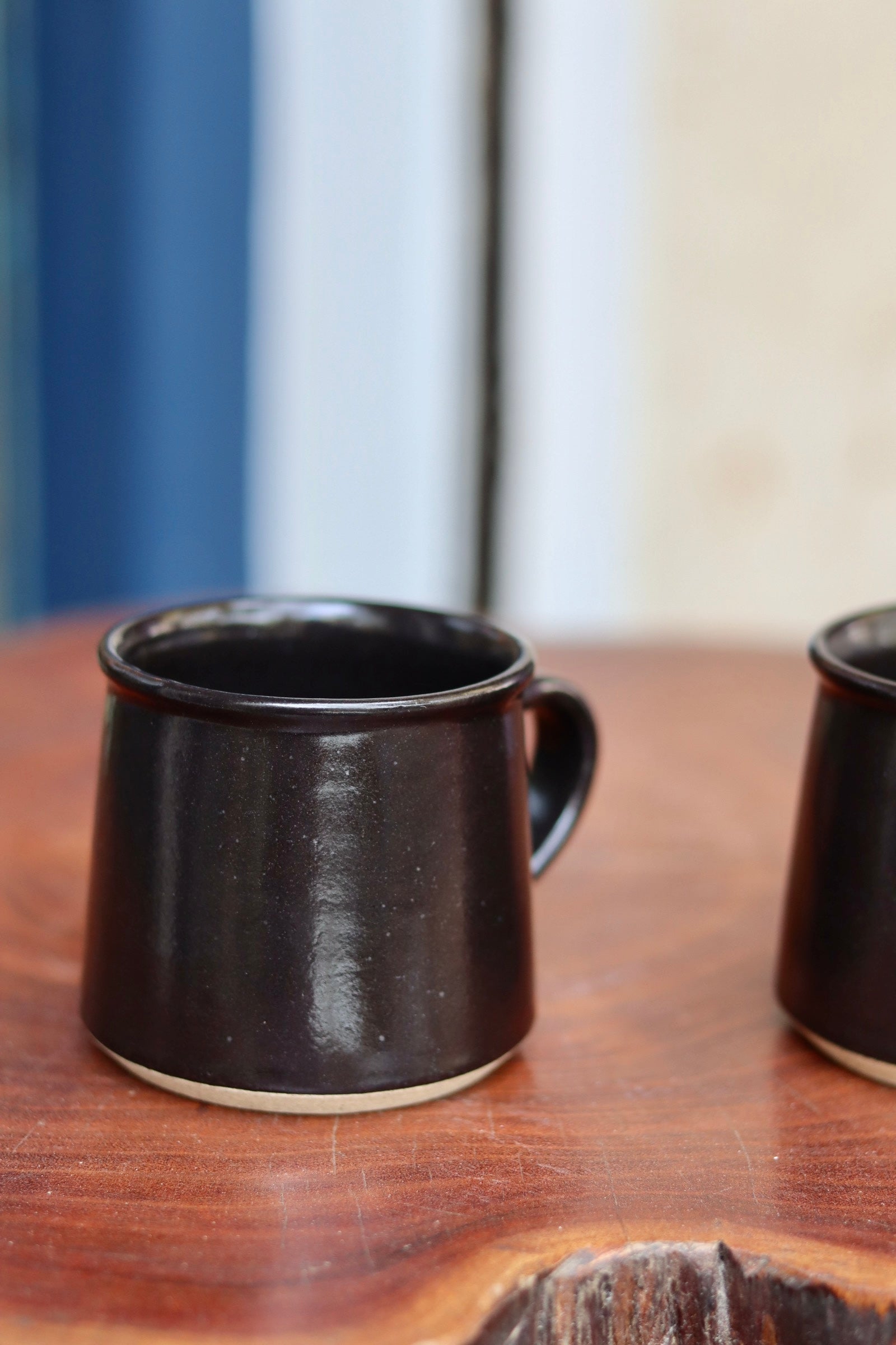 Charcoal coffee mug on a wooden table