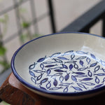 Handmade ceramic fish plate on table