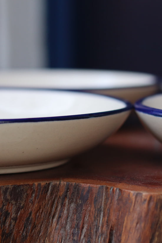 Boat pasta plate on wood