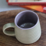A coffee mug on a wooden surface