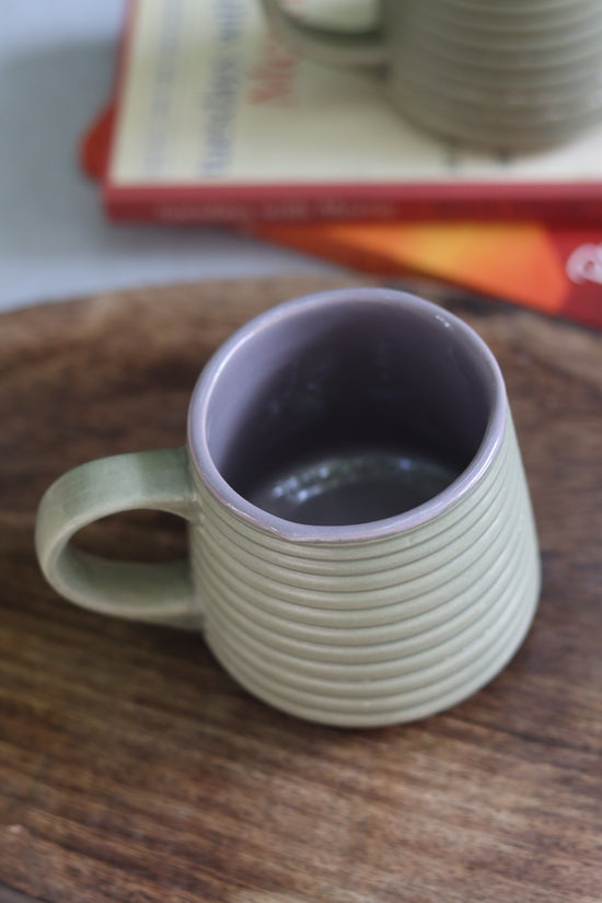A coffee mug on a wooden surface
