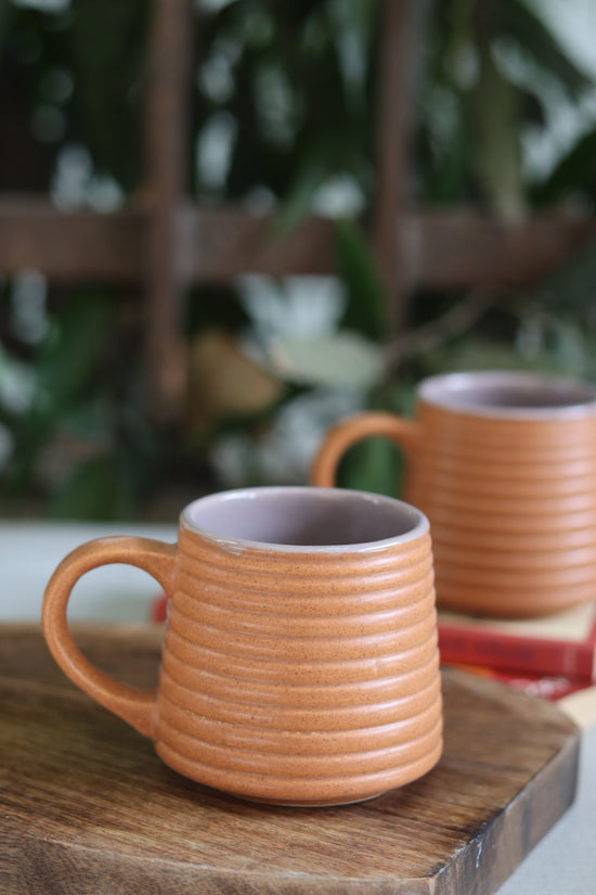 Two handmade ceramic mugs 