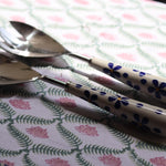 Two rice serving spoons of blue floral design