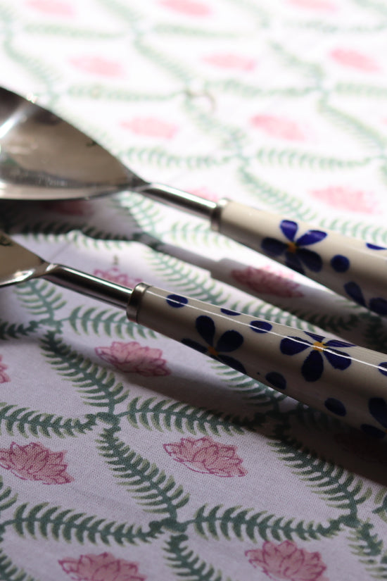 Two rice serving spoons of blue floral design
