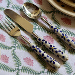 A floral cutlery set having spoon, knife and fork