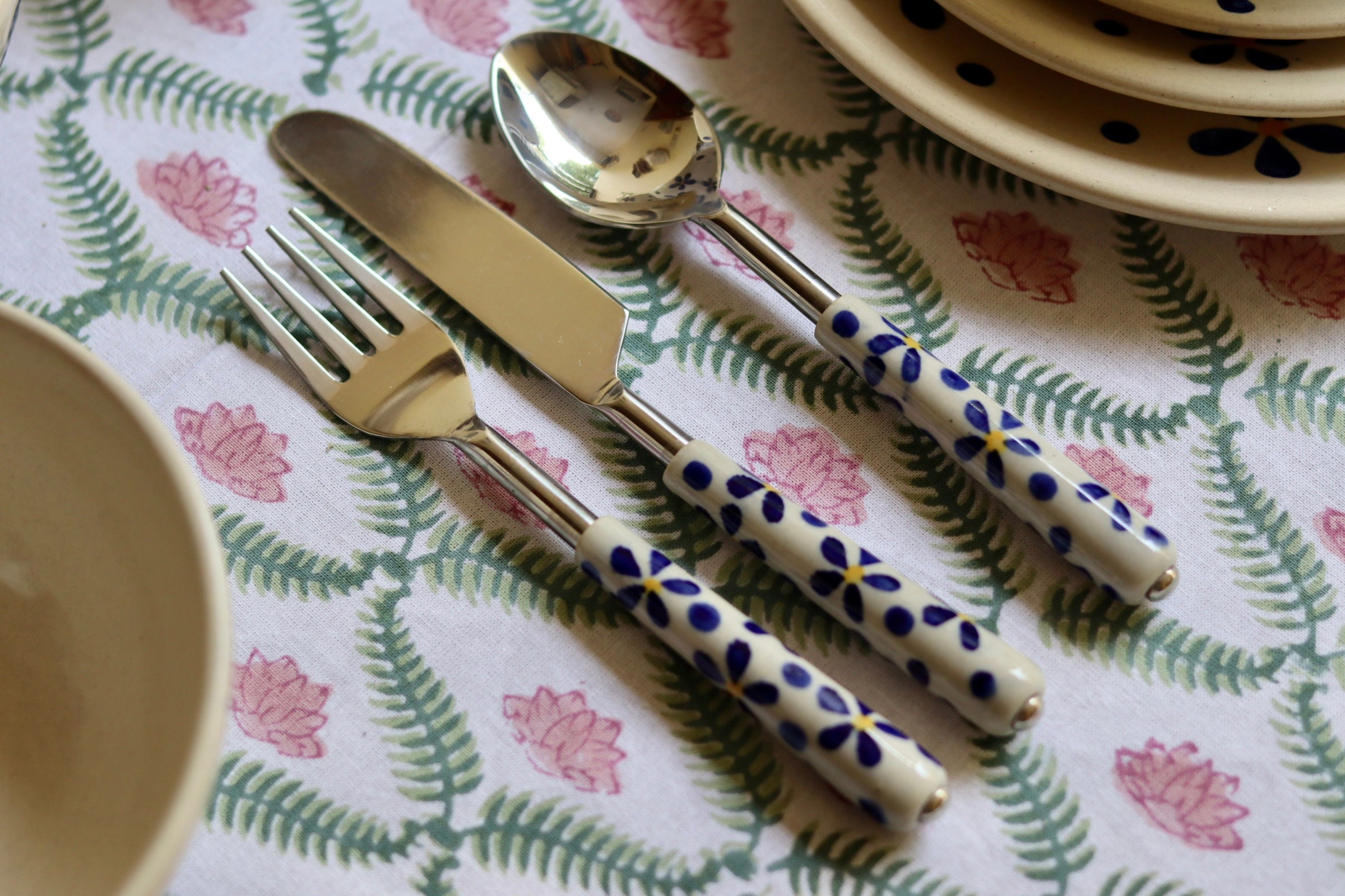 A floral cutlery set having spoon, knife and fork