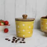 Handmade ceramic yellow polka jar with wooden lid