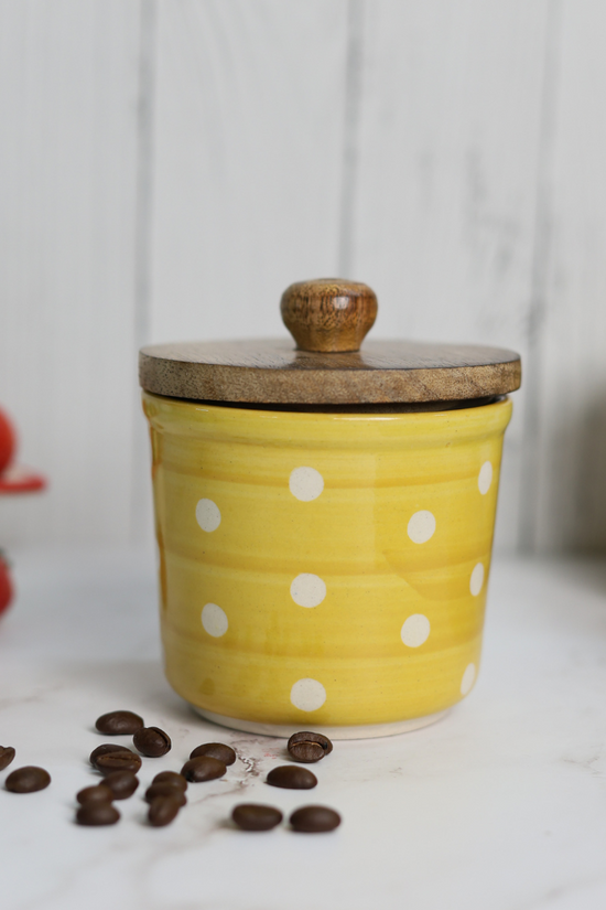 Handmade ceramic yellow polka jar with wooden lid