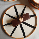 Handmade ceramic wheel platter with dessert 