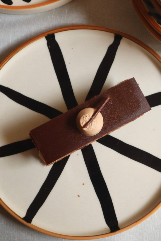 Handmade ceramic wheel platter with dessert 