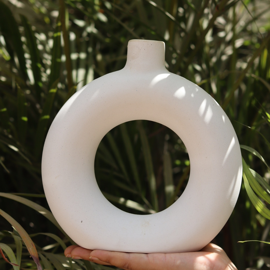 Handmade ceramic small donut vase white in hand 