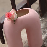 Pink leg flower vase with pink rose 