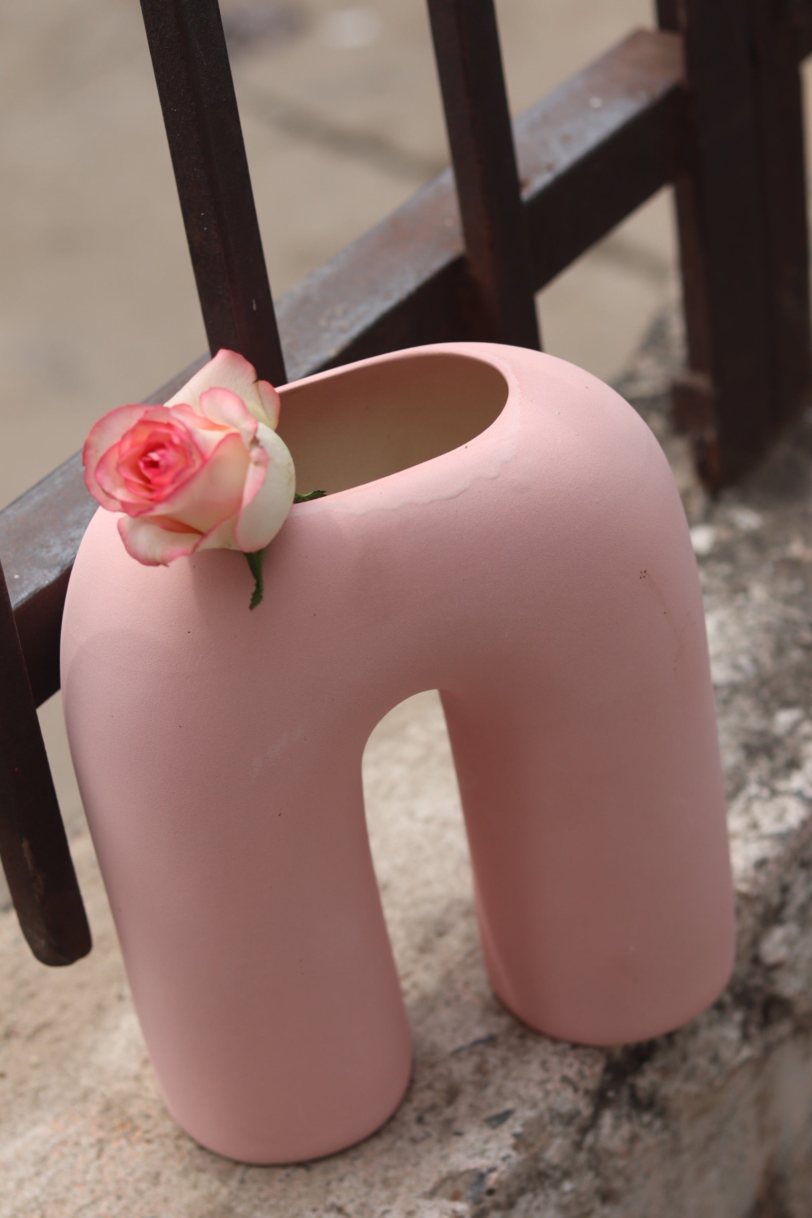 Pink leg flower vase with pink rose 