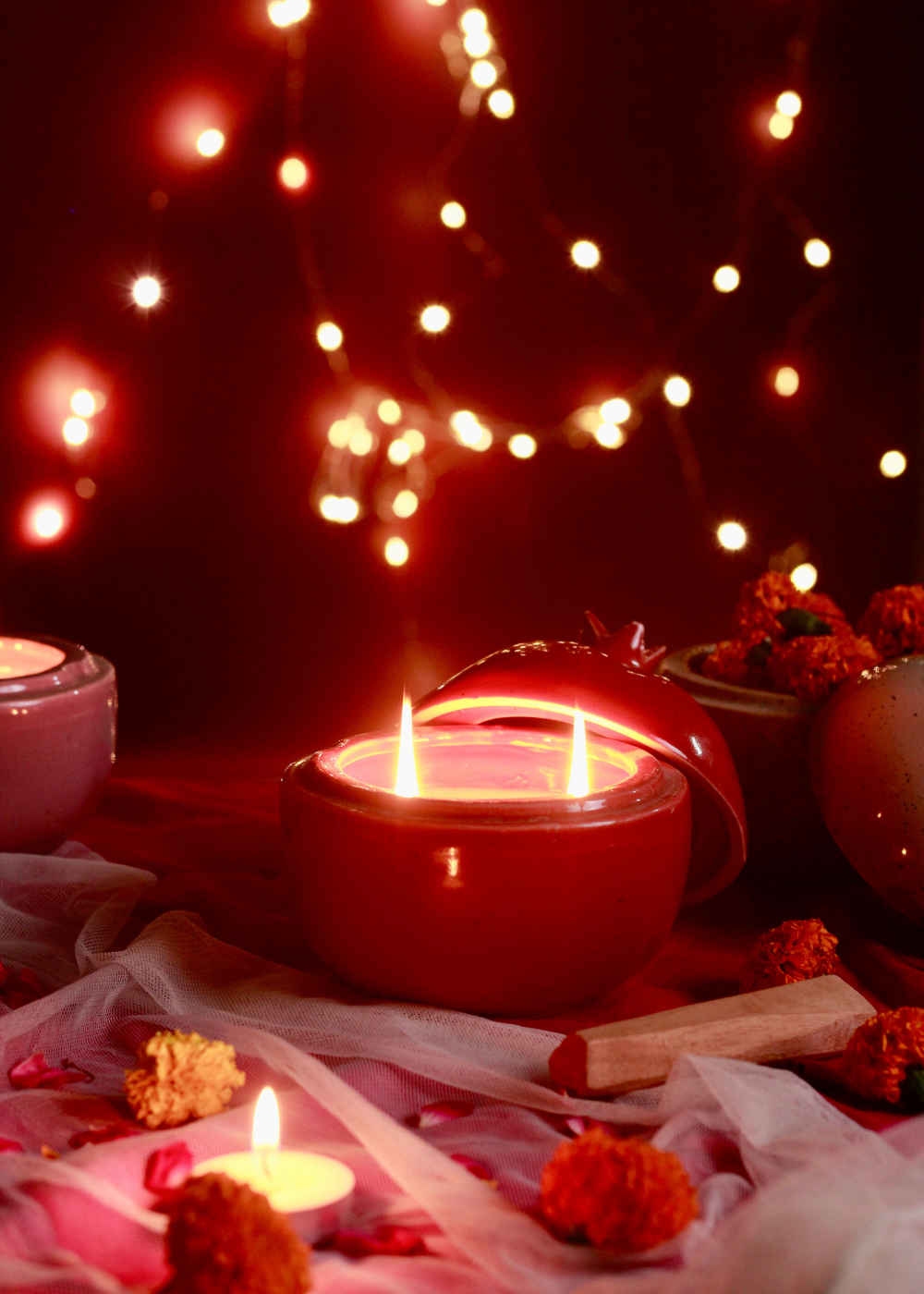 Anar shaped candle red color with flowers and lights
